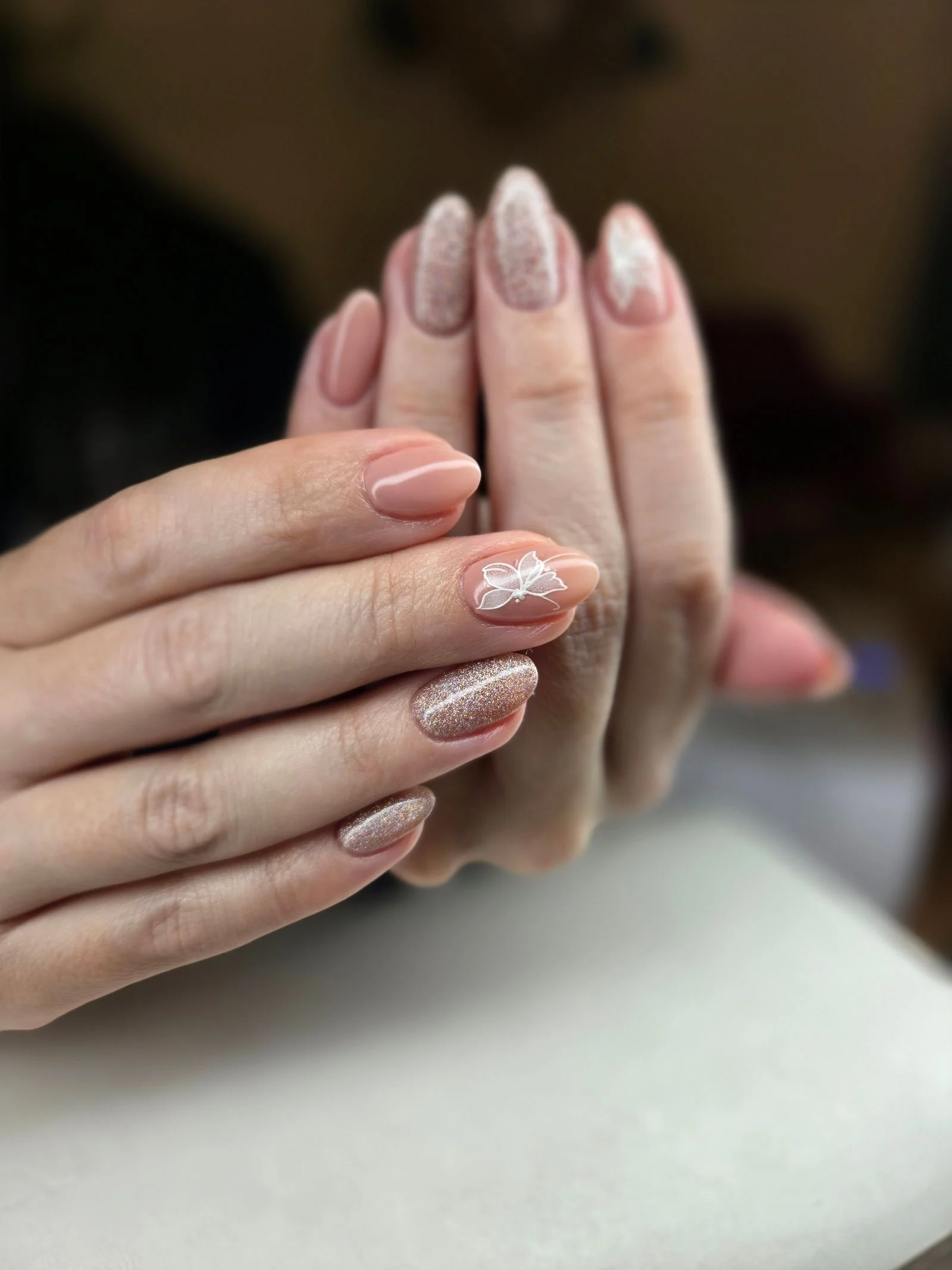 Detailed pink and glitter nail design